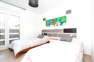 Een bed of bedden in een kamer bij 2 bedrooms appartement at Pas de la Casa 200 m away from the slopes with balcony and wifi