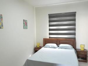 Postel nebo postele na pokoji v ubytování Charming apartment in Flic en Flac with shared pool