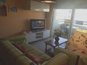 Гостиная зона в 3 bedrooms apartement at Matalascanas Almonte 200 m away from the beach with sea view shared pool and furnished terrace