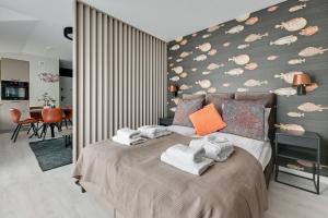 Posteľ alebo postele v izbe v ubytovaní Monte Carlo Luxury Suites with Parking by Lion Apartments Sopot