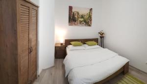 En eller flere senge i et værelse på Casa Milan