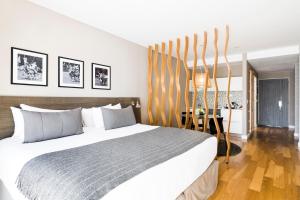 a bedroom with a large bed and a table at CasaSur Bellini in Buenos Aires +15 photos