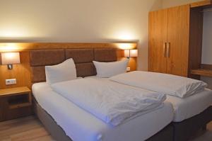Ein Bett oder Betten in einem Zimmer der Unterkunft Aparthotel Jägerhaus