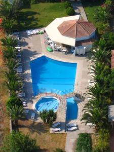 an overhead view of a swimming pool with a building at Faliro Hotel in Faliraki