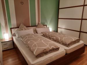 Postel nebo postele na pokoji v ubytování Ferienwohnung Odenwaldflair