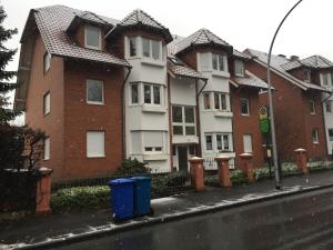a row of houses on the side of a street at Apartment am Kurpark in Bad Oeynhausen