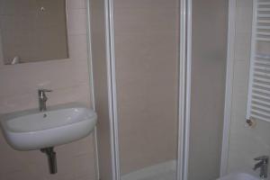 a bathroom with a sink and a shower at Del Nobile Apartment II in Turin +44 photos
