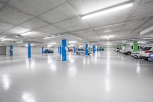 an empty parking garage with cars parked in it at Hotel Grauer Bär in Sölden