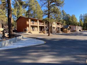 a house on the side of a road at Motel In The Pines in Munds Park