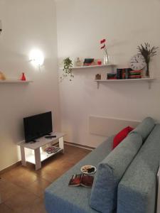 Televízia a/alebo spoločenská miestnosť v ubytovaní Easy Time