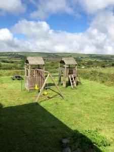 a couple of play structures in a field at the Engine Inn in Penzance