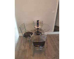 a glass table and two chairs in a room at Townhouse @ Nicholls Street Stoke in Stoke on Trent