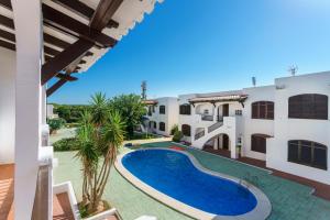 an image of a swimming pool in a villa at Apartamentos Posidonia in Son Parc