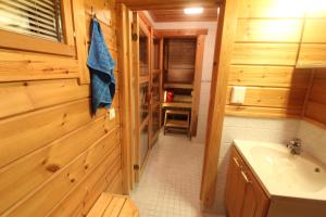 a bathroom with a sink and a toilet in a cabin at Ounasloma Holiday Cottages in Enontekiö +78 photos