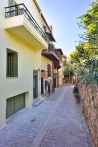 an empty street in front of a building at Elia Portou Luxury Residence in Chania