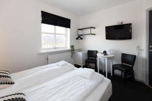 Postel nebo postele na pokoji v ubytování Skagen Hotel Annex
