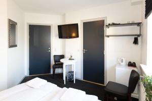 Postel nebo postele na pokoji v ubytování Skagen Hotel Annex