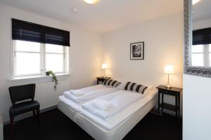 Postel nebo postele na pokoji v ubytování Skagen Hotel Annex