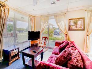 a living room with a couch and a table at OYO Hotel Drumright I-44 OK in Drumright