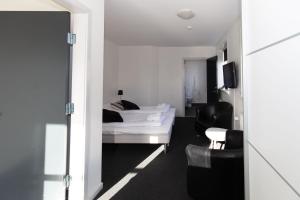 Postel nebo postele na pokoji v ubytování Skagen Hotel Annex