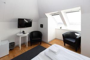 Postel nebo postele na pokoji v ubytování Skagen Hotel Annex