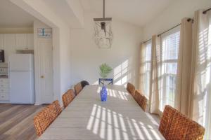 a dining room with a long table and chairs at 34 Pier Point Dr, Millville in Millville +42 photos