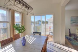 a dining room with a table with a plant on it at 34 Pier Point Dr in Millville