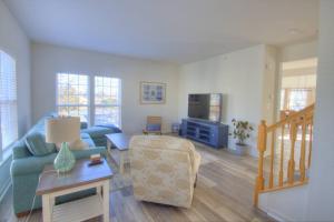 a living room with a couch and a tv at 34 Pier Point Dr in Millville