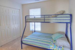 a bunk bed with a blue bunk bed frame in a room at 34 Pier Point Dr in Millville +42 photos