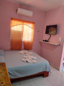 Postel nebo postele na pokoji v ubytování Central Rooms Bayahibe