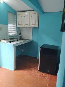Kuchyň nebo kuchyňský kout v ubytování Central Rooms Bayahibe