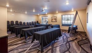 a room with rows of tables and chairs in it at Cobblestone Inn & Suites - Brookville in Brookville