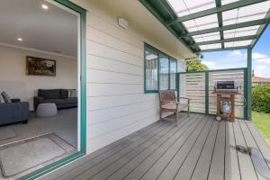 a screened in porch with a glass roof at Sunrise Getaway - Rotorua Holiday Home in Ohinemutu