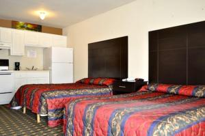Postel nebo postele na pokoji v ubytování Andrews Motor Inn