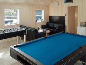 a living room with a pool table at 14 person holiday home in V ggerl se in Marielyst