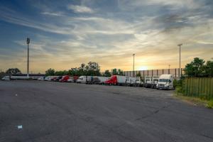 a row of trucks parked in a parking lot at Red Roof PLUS Newark Liberty Airport - Carteret in Carteret