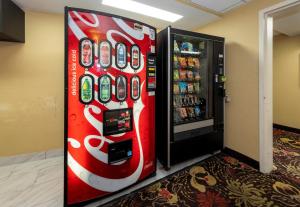 a coca cola vending machine in a room at Red Roof Inn PLUS Newark Liberty Airport - Carteret in Carteret