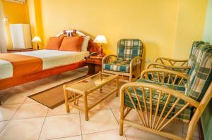 Postel nebo postele na pokoji v ubytování Hotel El Auca