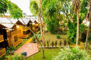 an aerial view of a resort with palm trees at Hotel El Auca in Puerto Francisco de Orellana