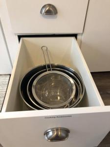 a metal bowl in a drawer in a kitchen at The Comfi Coral - Large 1 Bedroom Studio A in Baytown