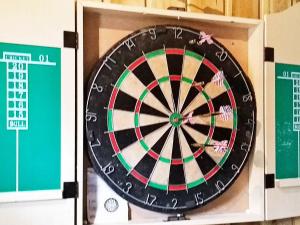 a dart board in a box with a dartboard at 10 person holiday home in V ggerl se in Marielyst