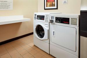 a washing machine and a washer in a room at SureStay Hotel by Best Western San Diego Pacific Beach in San Diego