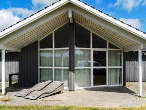 a large screened in porch of a house at 6 person holiday home in Harbo re in Harboør