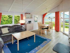 a living room with a couch and a table at 6 person holiday home in Gelting in Gelting