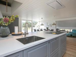 a kitchen with a sink and a counter top at 12 person holiday home in Vejers Strand in Vejers Strand