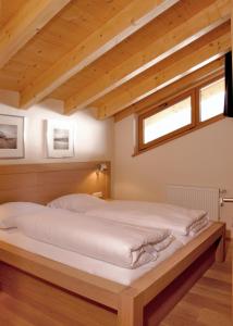 Säng eller sängar i ett rum på Residence Zillertal