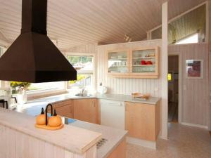 A kitchen or kitchenette at Three-Bedroom Holiday home in Sjølund 4