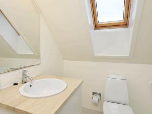 a bathroom with a sink and a toilet at 6 person holiday home in Skagen in Skagen