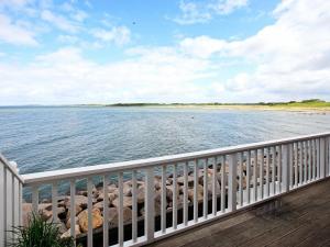 a view of the beach from the deck of a house at 6 person holiday home in Bagenkop in Bagenkop