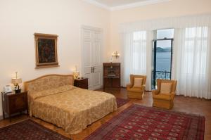 Postel nebo postele na pokoji v ubytování Villa Claudia dei Marchesi Dal Pozzo + 37 fotografií